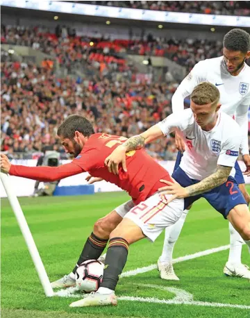  ?? Photo: Zimbio ?? Joe Gomez and Kieran Trippier of England put pressure on Isco of Spain during the UEFA Nations League A at Wembley Stadium in London, England on September 8, 2018. 18.