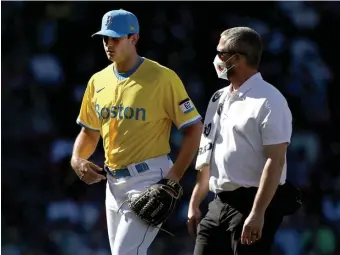  ?? NAnCy lAnE / HErAld stAff fIlE; BElOW lEft, stUArt CAHIll / HErAld stAff fIlE ?? ‘BIG HIT’: Red Sox relief pitcher Garrett Whitlock was officially placed on the injured list after leaving Sunday’s game with a right pectoral strain. In a correspond­ing move, Ryan Brasier, below left, was called up from Worcester.