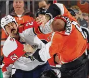  ?? BRUCE BENNETT / GETTY IMAGES ?? George Parros (left) played in 474 NHL games — and engaged in 169 fights — before retiring in December 2014.