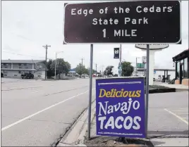  ?? Michelle L. Price ?? The Associated Press Street signs in May advertise downtown Blanding, Utah, attraction­s. The city, one of the last “dry” communitie­s in the Mormon-majority state, will ask voters Tuesday whether to allow beer and wine sales in town for the first time...