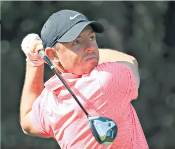  ??  ?? In the swing: Rory Mcilroy leads Tyrrell Hatton by one shot