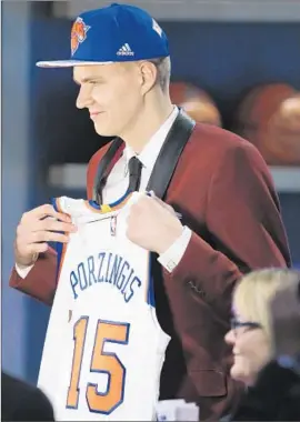  ?? Photog r aphs by Kathy Willens
Associated Press ?? KRISTAPS PORZINGIS of Latvia was selected fourth overall by the New York Knicks. Porzingis, 7 feet, was one of seven big men among the f irst 12 picks.