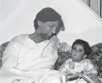  ?? Courtesy of the Montgomery County Sheriff's Office ?? Subir Chatterjee is seen in this 1984 photo with his nephew, Neil Chatterjee. The man would be shot and killed during a robbery in 2002 at his check-cashing business in Oak Ridge North.