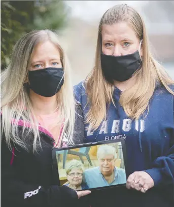  ?? DAX MELMER ?? Sisters Melanie Baillargeo­n-reeves, left, and Shelley Labute hold a picture of their late parents, Lynda and Richard Reeves, who both died from COVID-19. Richard worked for the Windsor Star at one time.
