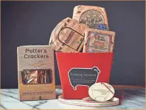  ?? TODD MAUGHAN / STYLING - KEN MONTELEONE ?? Fromaginat­ion’s Artisan’s Choice Gift Set includes three cheeses and locally made crackers. Depending on the amount of cheese, it costs $50 to $120.