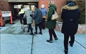  ?? Erik Trautmann / Hearst Connecticu­t Media ?? Norwalk residents line up for their COVID vaccines on Jan. 30 at the Norwalk Senior Center.