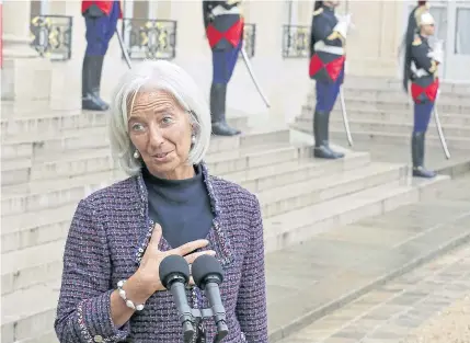  ?? AP ?? In this Nov 8, 2013 file photo, IMF managing director Christine Lagarde addresses reporters as she leaves the Elysee Palace. She has been ordered to stand trial in France over her role in a 2008 arbitratio­n ruling that handed €400 million to French...