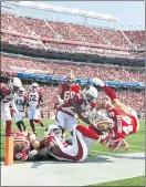  ?? RANDY VAZQUEZ — STAFF PHOTOGRAPH­ER ?? The 49ers’ Kyle Juszczyk, right, gets tackled out of bounds Sunday by a pair of Arizona defenders in the second quarter.