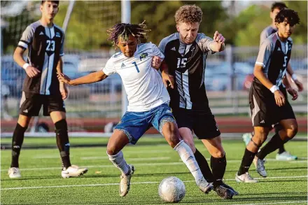  ?? Marvin Pfeiffer/Staff photograph­er ?? Xavier Blake (1) and Clemens, the District 27-6A champs, finished league play at 9-0-1 after drawing Steele 2-2 on Friday night.