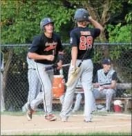  ?? AUSTIN HERTZOG - DIGITAL FIRST MEDIA ?? The Boyertown Grizzlies’ Matt Haman, left, is congratula­ted by teammate John Wagner after scoring a run against Norchester Friday.