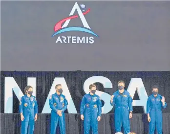  ?? JOHN RAOUX/AP ?? Heading for the stars: Five astronauts who will be part of the Artemis missions — Jessica Meir, from left, Joe Acaba, Anne McClain, Matthew Dominick and Jessica Watkins — are introduced by Vice President Mike Pence on Wednesday during the eighth meeting of the National Space Council at the Kennedy Space Center in Cape Canaveral, Florida.