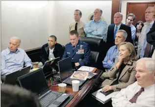  ?? PETE SOUZA/ THE WHITE HOUSE/ GETTY IMAGES FILES ?? Vice- President Joe Biden, left, President Barack Obama, Secretary of State Hillary Clinton and national security team members receive an update on the mission against Osama bin Laden May 1, 2011. The White House, CIA and defence department...