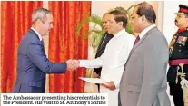  ??  ?? The Ambassador presenting his credential­s to the President. His visit to St. Anthony’s Shrine