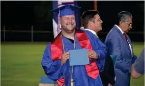  ?? ?? Bryson Aguiar poses for a photo after receiving his diploma during the Strathmore High School Class of 2023 graduation ceremony on Thursday night at Spartan Stadium.