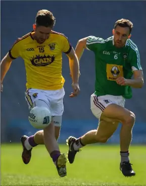  ??  ?? P.J. Banville on the move as Kevin Maguire of Westmeath gives chase.