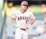  ?? GARY A. VASQUEZ USA TODAY NETWORK ?? Los Angeles Angels center fielder Mike Trout rounds the bases after hitting a solo home run against the Baltimore Orioles at Angel Stadium on April 23.