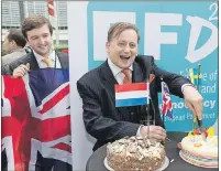  ?? AP PHOTO ?? Britain’s U.K. Independen­ce Party (UKIP) MEP Ray Finch (right) celebrates the official triggering of Article 50 of the Lisbon Treaty in Brussels on Wednesday.