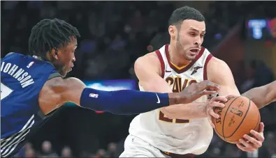  ?? USA TODAY SPORTS ?? Cleveland Cavaliers forward Larry Nance Jr drives past Detroit Pistons forward Stanley Johnson in the fourth quarter of the Cavs’ 11290 home victory on Monday.