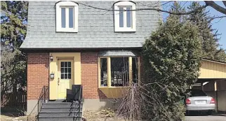  ??  ?? The carpeted stairs, imposing roof, and untrimmed greenery all need work on this 1950’ s Lachine property.