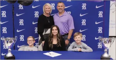  ?? Scott Herpst ?? Autumn and Jason Layne were among those on hand at Ringgold High School last week to watch senior Taylor Layne sign on to play softball at Middle Georgia State University. Also present for the ceremony were Jacob and Boston Layne.