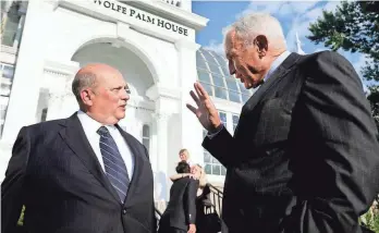  ?? ERIC ALBRECHT/COLUMBUS DISPATCH FILE ?? Dispatch Publisher John F. Wolfe speaks with L. Brands founder Les Wexner at the unveiling of the “John F. Wolfe Palm House” at the Franklin Park Conservato­ry. The naming of the building was a birthday surprise for Wolfe.