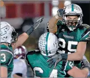  ?? MEDIANEWS GROUP FILE PHOTO ?? Pennridge’s Mike Class is hoisted by teammate Cory Blazer (64) after his third touchdown against Abington in the fourth quater of the Rams playoff contest at Poppy Yoder Field on Friday November 9,2012.