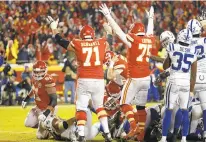  ?? CHARLIE RIEDEL/ASSOCIATED PRESS ?? Kansas City 31, Indianapol­is 13 Dallas at Los Angeles Rams, late Los Angeles Chargers at New England, 1 p.m. (CBS)Philadelph­ia at New Orleans, 4:30 p.m. (Fox) Kansas City Chiefs' Mitchell Schwartz (71) and Cameron Erving (75) celebrates a touchdown against the Indianapol­is Colts on Saturday.