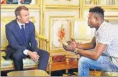  ?? REUTERS ?? French President Emmanuel Macron (left) meets Mamoudou Gassama, 22, from Mali at the Elysee Palace in Paris.