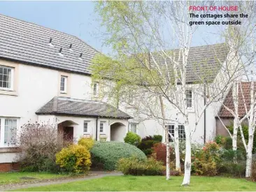  ??  ?? FRONT OF HOUSEThe cottages share the green space outside