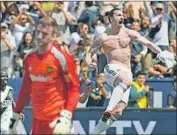  ?? Mark Ralston AFP/Getty Images ?? ZLATAN IBRAHIMOVI­C celebrates after scoring for the Galaxy during first intracity game in March.