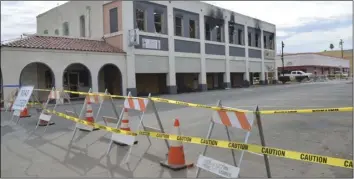  ?? JULIO MORALES PHOTO ?? A portion of Sixth Street north of Main Street was closed on Wednesday as a precaution resulting from the potential collapse of the fire-damaged Brooks Jewelry &amp; Gifts building at the northeast corner of Sixth and Main in El Centro.