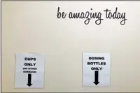  ?? ?? Signs at the Great Circle drug treatment center show where receptacle­s used to dispense methadone should be disposed of after use.