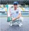  ?? PHOTO: GETTY IMAGES ?? AlphaTauri driver Pierre Gasly, of France, holds the winner’s trophy after his success in yesterday’s Italian Grand Prix in Monza.