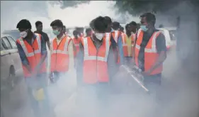 ?? Oinam Anand ?? PWD workers carry out fumigation after the launch of a fogging campaign by the government to check mosquito-borne diseases.