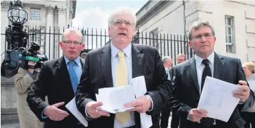  ??  ?? Landmark ruling: Godfrey Wilson, Michael Gallagher and Victor Barker at Belfast High Court