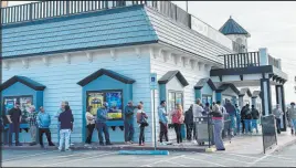  ?? Brett Clarkson Las Vegas Review-journal ?? Thousands of people lined up to buy Powerball tickets Saturday at The Lotto Store at Primm. An estimated 9,000 people bought tickets at the store Saturday.
