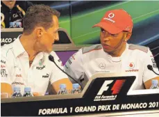  ?? FOTO: IMAGO IMAGES ?? Im Jahr 2012 noch Konkurrent­en auf der Rennstreck­e: Michael Schumacher (links) und Lewis Hamilton. Schon bald könnte der Engländer sein Vorbild in Sachen Grand-Prix-Siege überflügel­n.
