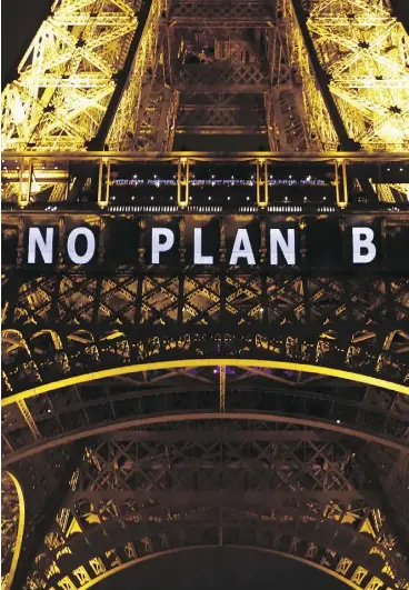  ?? FRANCOIS MORI / THE ASSOCIATED PRESS FILES ?? “NO PLAN B” is projected on the Eiffel Tower as part of the COP21, UN Climate Change Conference in Paris in 2015.