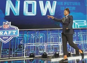  ?? AP ?? ■ Central Florida’s Shaquem Griffin walks out onto the stage at the start of the first round of the NFL draft in Arlington.