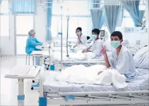  ?? THAILAND GOVERNMENT HANDOUT PHOTO THE ASSOCIATED PRESS ?? In this image made from video, released by the Thailand Government Spokesman Bureau, three of the 12 boys are seen recovering in their hospital beds after being rescued along with their coach from a flooded cave in Mae Sai, Chiang Rai province,...