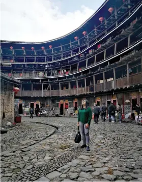  ??  ?? FIVE-STOREY Tulou house.