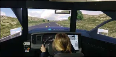  ?? BILL RETTEW - DIGITAL FIRST MEDIA ?? Rustin High School Senior Capri Mancini finds out what it’s like to drive while impaired behind the wheel of a driving simulator.