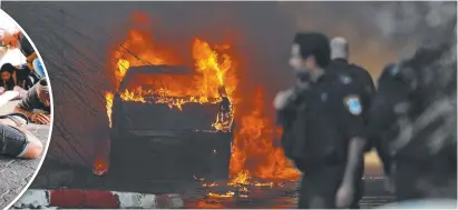  ??  ?? A vehicle in the southern Israeli town of Sderot that was hit with rockets from the Gaza Strip on November 12.