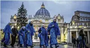  ?? BEN CURTIS / AP ?? Nuns arrive at dawn to view the body of Pope Emeritus Benedict XVI at the Vatican on Tuesday.