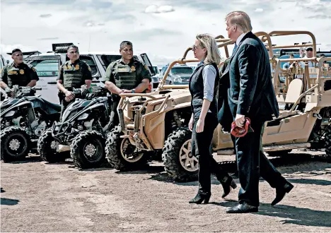  ?? JACQUELYN MARTIN/AP ?? President Trump and Homeland Security Secretary Kirstjen Nielsen tour a section of the border Friday in Calexico, Calif.