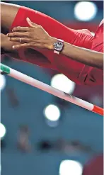  ??  ?? Right: Mutaz Essa Barshim clears 2.37m to take gold at the World Championsh­ips in Doha; below, heptathlet­e Nafissatou Thiam, the first woman to join the Richard Mille athletes team, competing in Doha wearing her RM 007 Titanium
