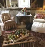  ??  ?? The chicken crate is repurposed into a coffee table and the original registers from the house adorn the walls.