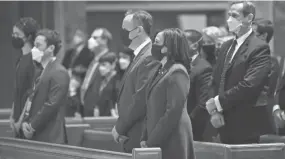  ?? CHIP SOMODEVILL­A/GETTY IMAGES ?? Vice Presiden Kamala Harris and her husband Doug Emhoff attend services at the Cathedral of St. Matthew the Apostle on Wednesday.