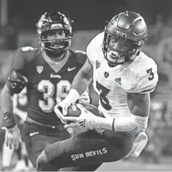  ?? ANDY NELSON/AP ?? Arizona State running back Rachaad White (3) hauls in a pass past Oregon State linebacker Omar Speights (36).