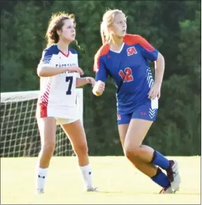  ??  ?? Starkville Academy soccer player Meredith Reed (12) looks to get position against an East Rankin Academy defender on Thursday. (Photo by Danny P. Smith, SDN)